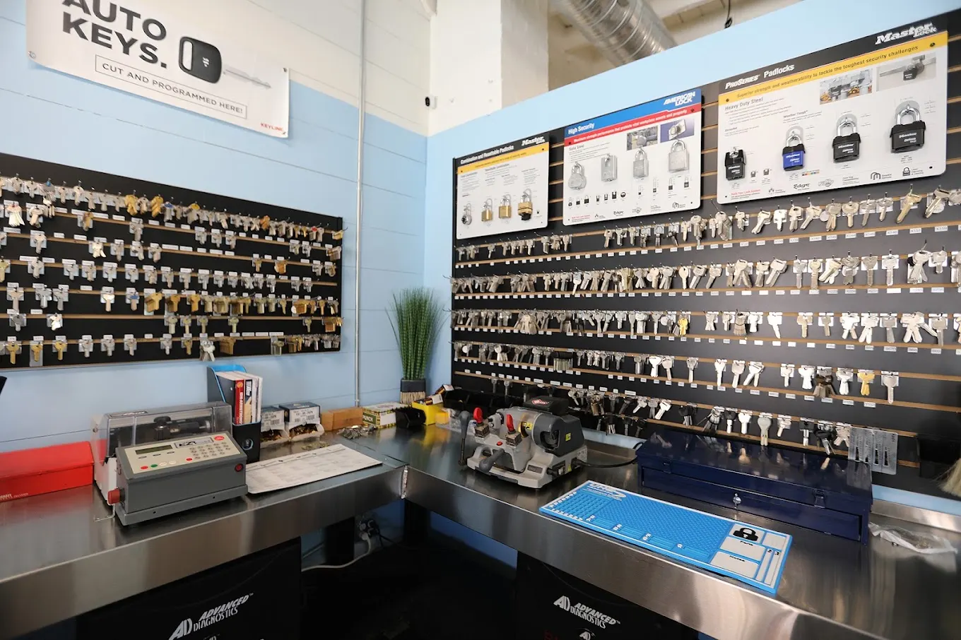 The We Do Locksmith shop interior with the Auto Keys sign, key walls and counter